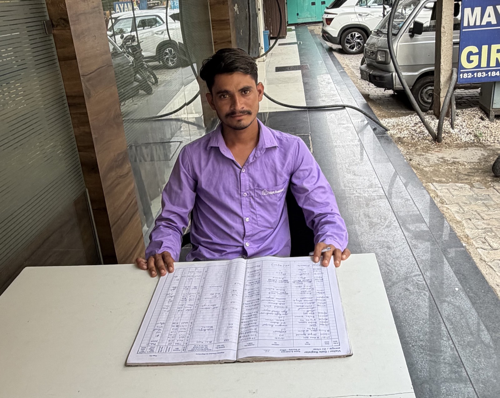 Male reception staff member at the Maya Residency Rajiv Gandhi Nagar front desk
