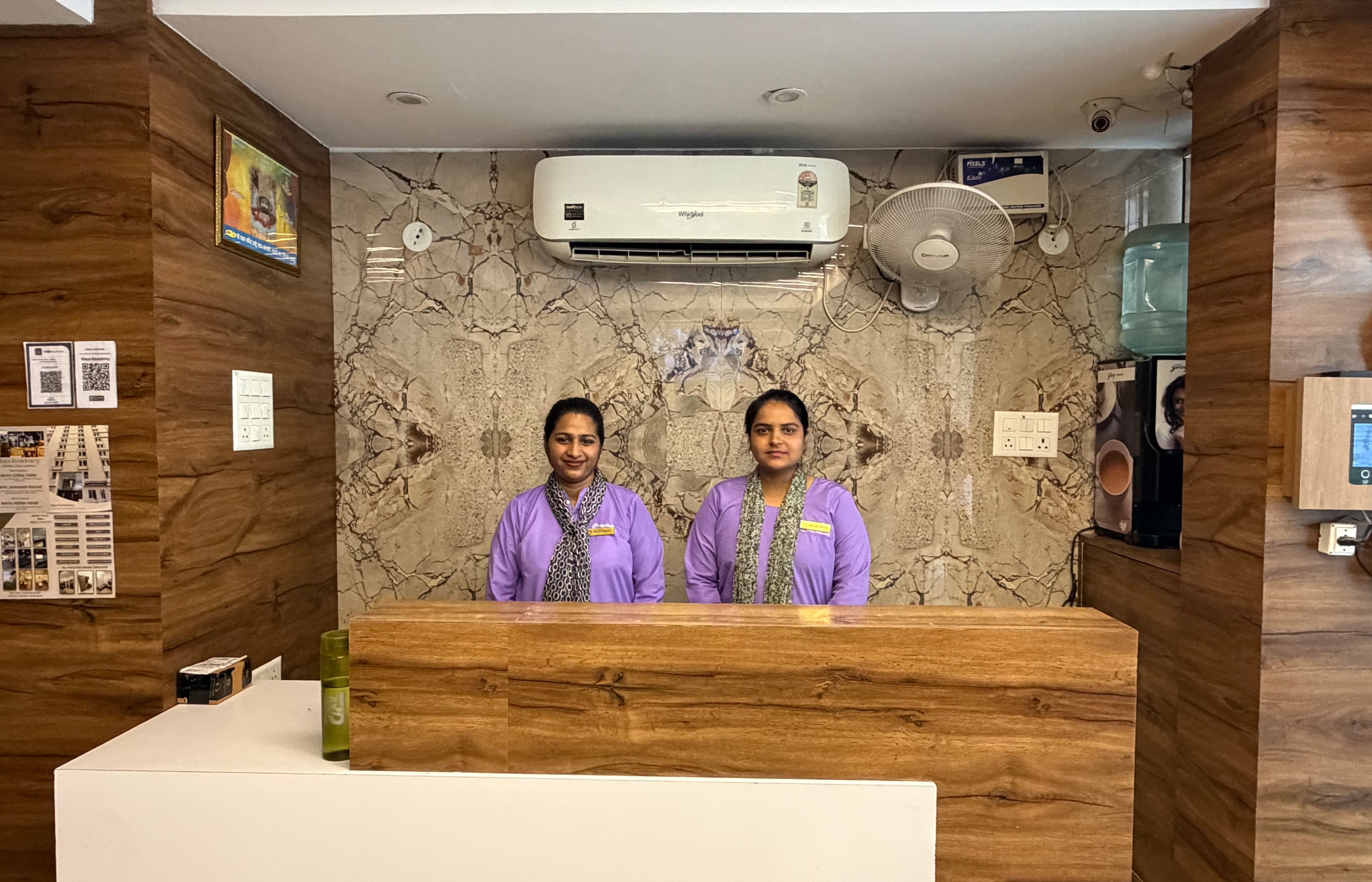 Reception staff at the Maya Residency front desk
